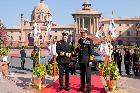 Indian Navy Chief Admiral Dinesh K Tripathi, right, greets Hellenic Navy Chief Vice Admiral Dimitrios-Eleftherios Kataras at the South Block Lawns, in New Delhi.