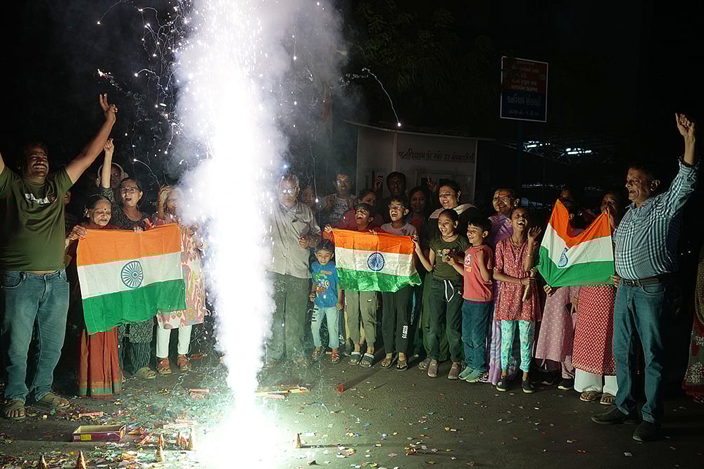 Fans celebrate Indias T20 World Cup win over Pakistan in Ahmedabad