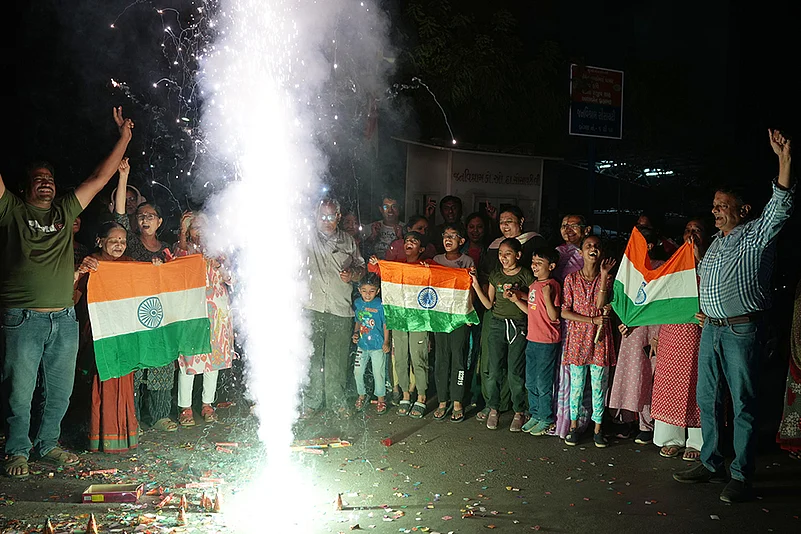 Fans celebrate Indias T20 World Cup win over Pakistan in Ahmedabad