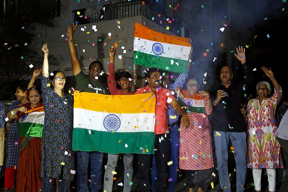 Fans celebrate Indias T20 World Cup win over Pakistan in Ahmedabad