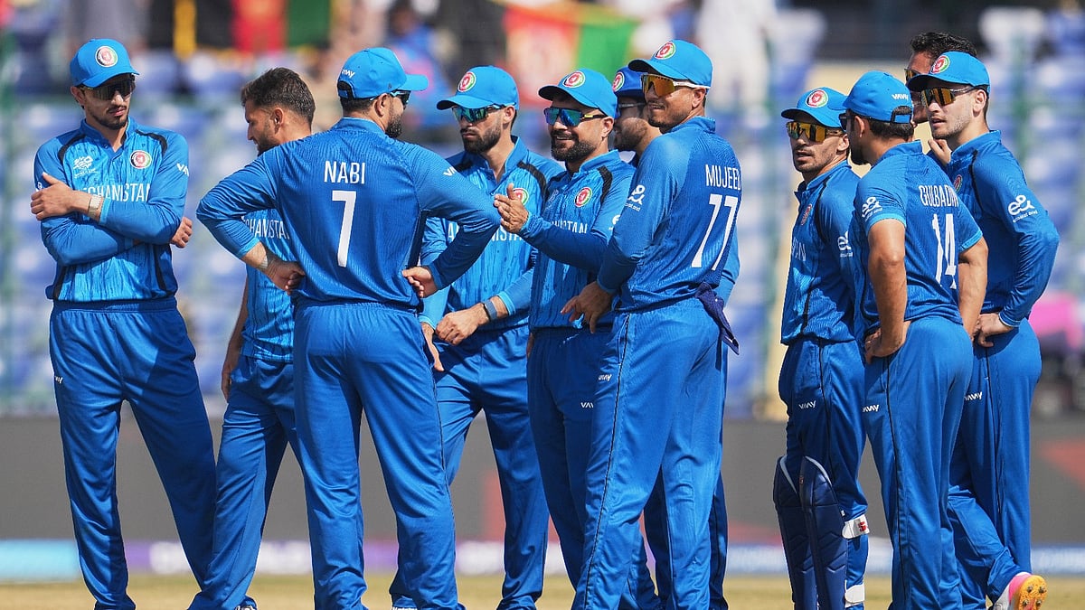 Afghanistan's captain Rashid Khan, centre, celebrates with teammates the wicket of United Arab Emirates' Aryansh Sharma during the T20 World Cup cricket match between Afghanistan and United Arab Emirates in New Delhi, India, Monday, Feb. 16, 2026.  - (AP Photo/Manish Swarup)