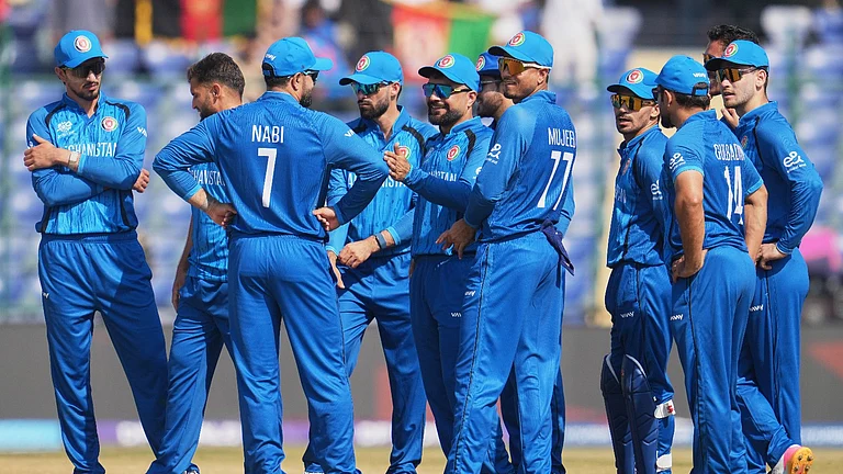 Afghanistan's captain Rashid Khan, centre, celebrates with teammates the wicket of United Arab Emirates' Aryansh Sharma during the T20 World Cup cricket match between Afghanistan and United Arab Emirates in New Delhi, India, Monday, Feb. 16, 2026. - (AP Photo/Manish Swarup)