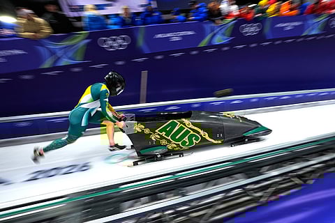 Australia's Bree Walker starts for a women's monobob run at the 2026 Winter Olympics, in Cortina d'Ampezzo, Italy.