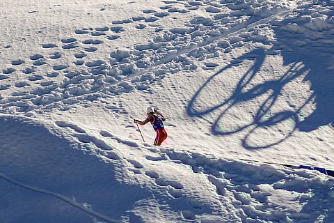 Johannes Hoesflot Klaebo, of Norway, skis uphill during the cross country skiing men's 4 x 7.5km relay at the 2026 Winter Olympics, in Tesero, Italy.