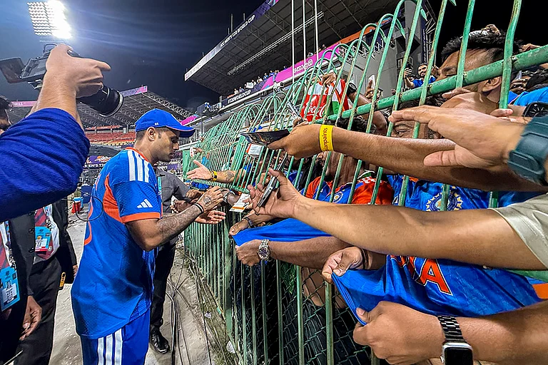 India's captain Suryakumar Yadav signs autographs for fans after winning the ICC Men's T20 World Cup 2026 cricket match between India and Pakistan, at R Premadasa Stadium, in Colombo, Sri Lanka. - | Photo: PTI/Arun Sharma