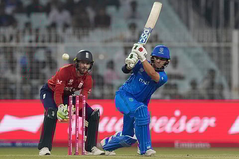 Italy's Justin Mosca plays a shot during the T20 World Cup cricket match between England and Italy in Kolkata, India.