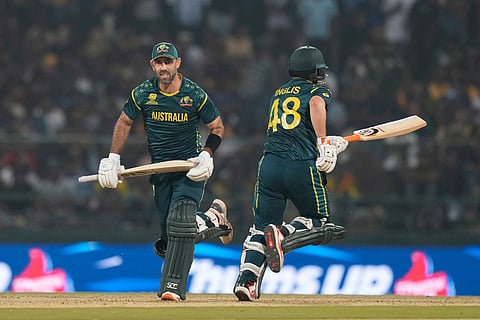 Australia's Glenn Maxwell, left, and Australia's Josh Inglis run between the wickets during the T20 World Cup cricket match between Sri Lanka and Australia in Pallekele, Sri Lanka.