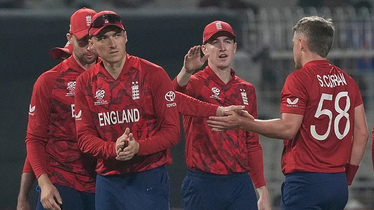 England's Sam Curran, right, celebrates with teammates the wicket of Italy's Marcus Campopiano during the T20 World Cup cricket match between England and Italy in Kolkata, India, Monday, Feb. 16, 2026. - AP Photo/Bikas Das