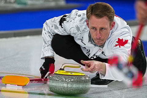 Canada's Marc Kennedy in action during the men's curling round robin session against China, at the 2026 Winter Olympics, in Cortina d'Ampezzo, Italy.