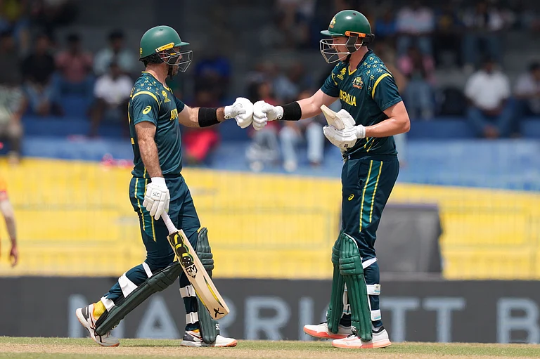 Australia's Glenn Maxwell, left, and Matthew Renshaw greets each other during the T20 World Cup cricket match between Australia and Zimbabwe in Colombo, Sri Lanka, Friday, Feb. 13, 2026. - | Photo: AP/Eranga Jayawardena