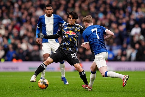 Leeds United's Ao Tanaka, left, and Birmingham City's Tommy Doyle battle for the ball during the Emirates FA Cup fourth round match in Birmingham, England.