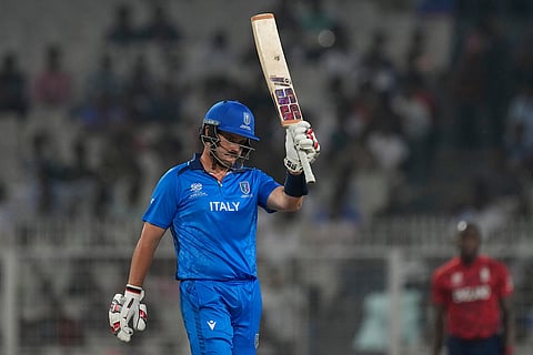 Italy's Benjamin Manenti celebrates his fifty runs during the T20 World Cup cricket match between England and Italy in Kolkata, India.