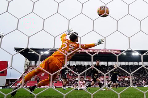 Stoke City's Bae Jun-Ho, rear centre, scores his sides first goal during the English FA Cup fourth round match between Stoke City and Fulham, in Stoke, England.