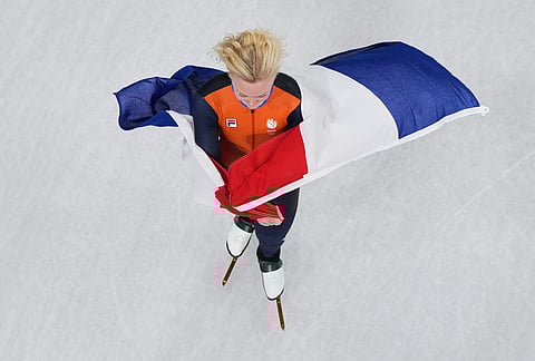 Xandra Velzeboer of the Netherlands celebrates the gold after the women's 1,000 meters short track speed skating at the 2026 Winter Olympics, in Milan, Italy.