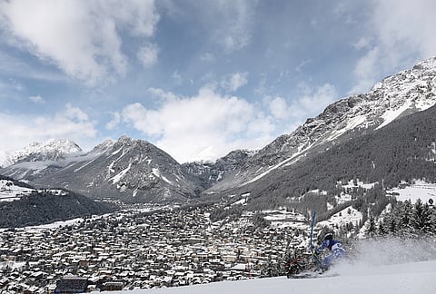 Chile's Tomas Holscher speeds down the course during an alpine ski, men's slalom race, at the 2026 Winter Olympics, in Bormio, Italy.