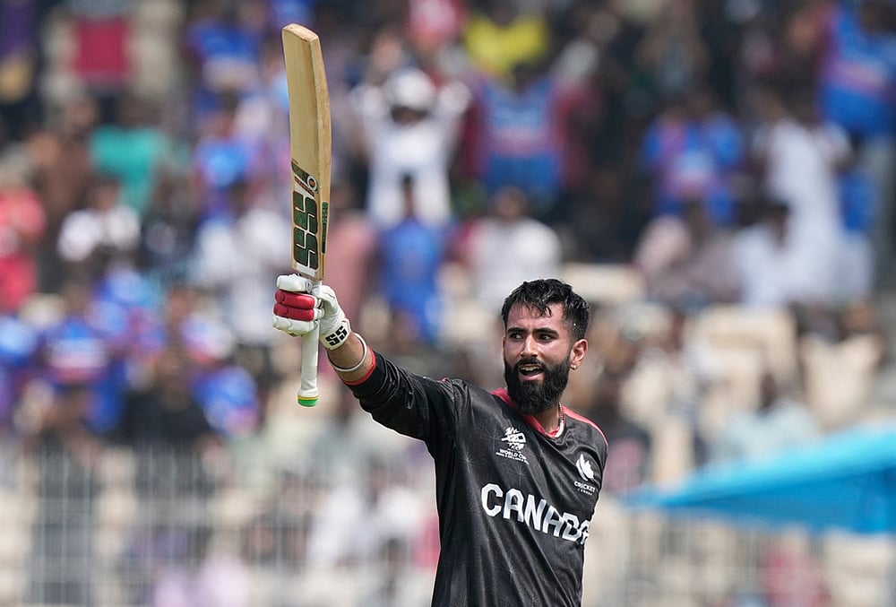 Canada's Yuvraj Samra celebrates his century during the T20 World Cup cricket match between Canada and New Zealand in Chennai. - | Photo: AP/Mahesh Kumar A.