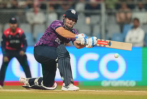 Scotland's George Munsey plays a shot during the T20 World Cup cricket match between Nepal and Scotland in Mumbai.