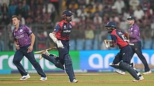 (AP Photo/Rafiq Maqbool) : Nepal's Dipendra Singh Airee with batting partner Gulshan Jha run between the wickets to score during the T20 World Cup cricket match between Nepal and Scotland in Mumbai, India, Tuesday, Feb. 17, 2026