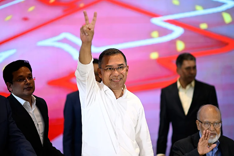 Bangladesh Nationalist Party Chairperson Tarique Rahman greets supporters after his party won the national parliamentary election, in Dhaka, Bangladesh, Saturday, Feb. 14, 2026. (AP Photo/Mahmud Hossain Opu)
- MAHMUD HOSSAIN OPU Source: AP
