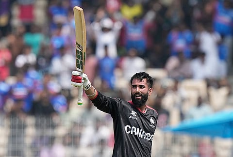 Canada's Yuvraj Samra celebrates his century during the T20 World Cup cricket match between Canada and New Zealand in Chennai.