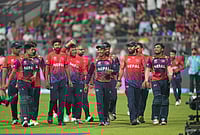 | Photo: AP/Rafiq Maqbool : Nepal cricket team walks back to the pavilion after defeating Scotland during the T20 World Cup cricket match in Mumbai.