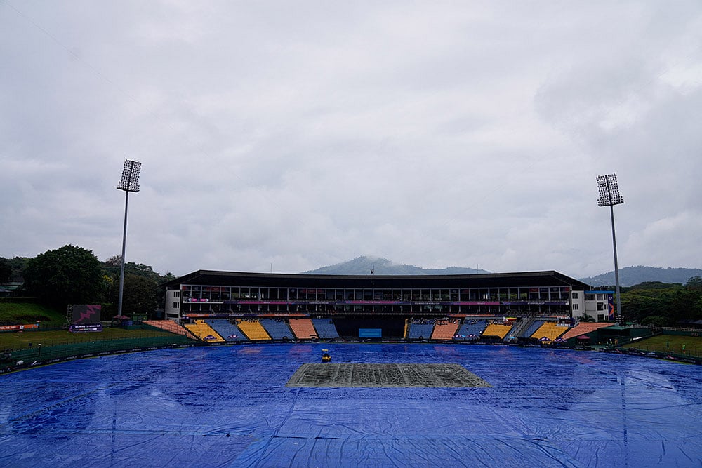 The ground is covered as rain delayed the start of play during the T20 World Cup cricket match between Ireland and Zimbabwe in Pallekele, Sri Lanka. - | Photo: AP/Eranga Jayawardena