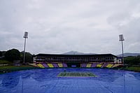 | Photo: AP/Eranga Jayawardena : The ground is covered as rain delayed the start of play during the T20 World Cup cricket match between Ireland and Zimbabwe in Pallekele, Sri Lanka.