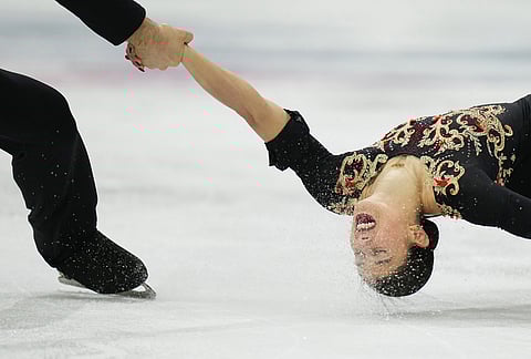 Rebecca Ghilardi and Filippo Ambrosini of Italy compete during the pairs figure skating long program at the 2026 Winter Olympics, in Milan, Italy.