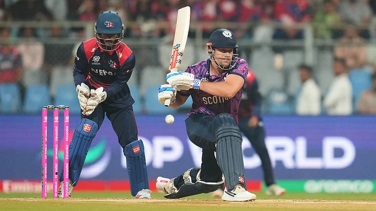 Scotland's George Munsey plays a shot during the T20 World Cup cricket match between Nepal and Scotland in Mumbai, India, Tuesday, Feb. 17, 2026 - (AP Photo/Rafiq Maqbool)