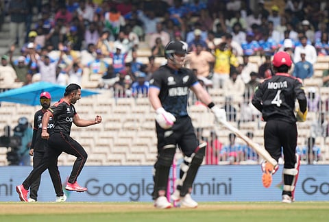 Canada's Saad Bin Zafar, left, celebrates the wicket of New Zealand's Tim Seifert during the T20 World Cup cricket match between Canada and New Zealand in Chennai.