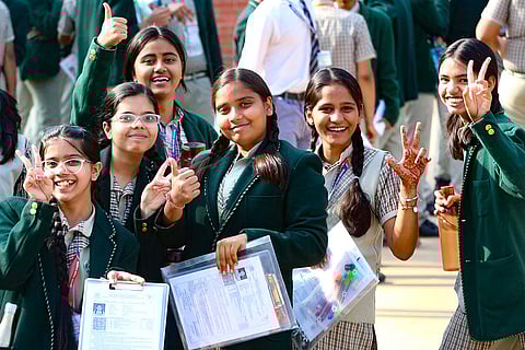 Class 10 students cheer before appearing for a Central Board of Secondary Education (CBSE) examination.