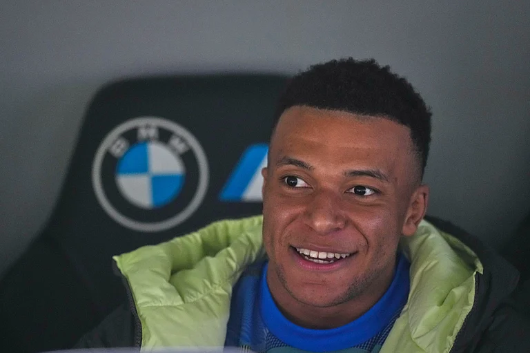 Real Madrid's Kylian Mbappe sits on the bench prior to the Spanish La Liga soccer match between Real Madrid and Real Sociedad in Madrid, Spain, Saturday, Feb. 14, 2026. (AP Photo/Manu Fernandez) - AP/Manu Fernandez