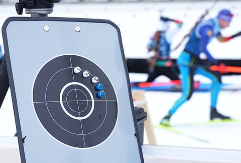 Athletes participate in a biathlon training session at the 2026 Winter Olympics in Anterselva, Italy.