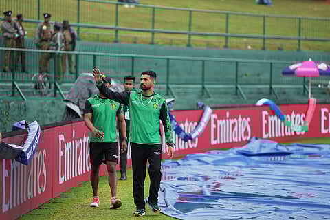 Zimbabwe's captain Sikandar Raza waves to the supporters as rain delayed the start of play during the T20 World Cup cricket match between Ireland and Zimbabwe in Pallekele, Sri Lanka.