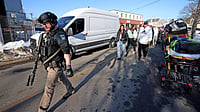 AP Photo : Witnesses follow police outside of the Lynch Arena in Pawtucket, Rhode Island., after a shooting at the ice rink.