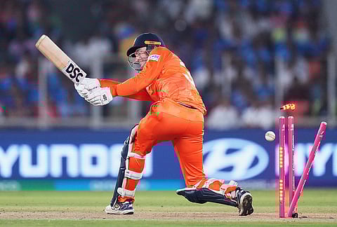 Netherlands' captain Scott Edwards is bowled out by India's Jasprit Bumrah during the T20 World Cup cricket match between India and Netherlands in Ahmedabad.