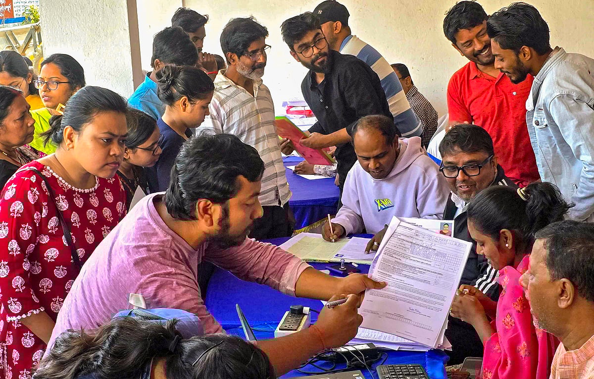 People gather at the Suri Municipality office after the West Bengal government launched the Banglar Yuva Sathi scheme, in Birbhum district, West Bengal, Monday, Feb. 16, 2026 - PTI