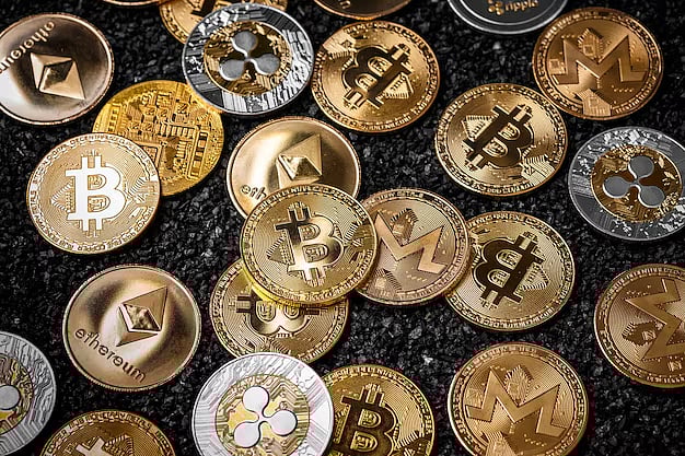 Assorted cryptocurrency coins including Bitcoin and Ethereum on dark surface