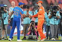 India Vs Netherlands, ICC T20 World Cup 2026: See Best Photos From Ahmedabad's Narendra Modi Stadium | Photo: AP/Ajit Solanki : India's captain Suryakumar Yadav, left, and Netherlands' captain Scott Edwards shake hands after the coin toss of the T20 World Cup cricket match between India and Netherlands in Ahmedabad.