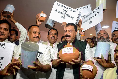 LoP in the Madhya Pradesh Assembly and Congress leader Umang Singhar with party MLAs stages a protest during the Budget session of the state Assembly, in Bhopal.