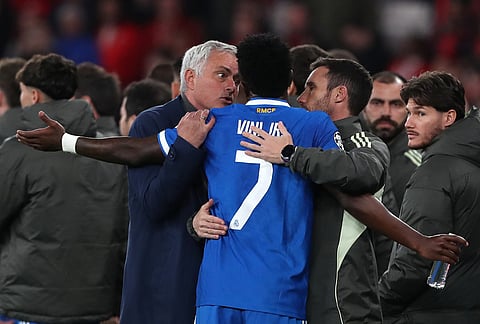 Real Madrid's Vinicius Junior argues with Benfica's head coach José Mourinho after scoring the opening goal during a Champions League playoff soccer match between SL Benfica and Real Madrid in Lisbon, Portugal.