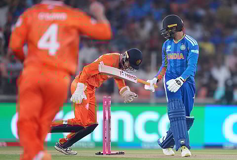 India's Abhishek Sharma, right, reacts after getting bowled out by Netherlands' Aryan Dutt during the T20 World Cup cricket match between India and Netherlands in Ahmedabad.