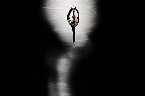 Zhang Ruiyang of China competes during the women's short program figure skating at the 2026 Winter Olympics, in Milan, Italy.