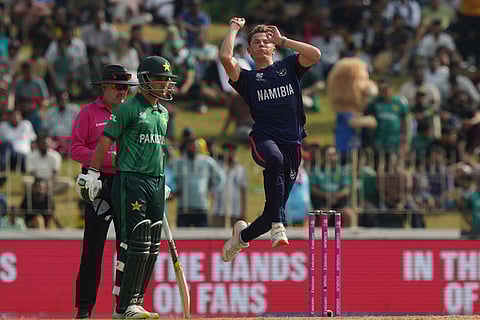 Namibia's Jack Brassell bowls a delivery during the T20 World Cup cricket match between Namibia and Pakistan in Colombo, Sri Lanka.