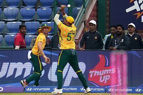 South Africa's Jason Smith misses the catch as Anrich Nortje looks on during the T20 World Cup cricket match between South Africa and United Arab Emirates in New Delhi, India.