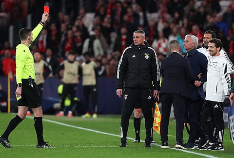 Benfica's head coach José Mourinho receives a red card by referee François Letexier, during a Champions League playoff soccer match between SL Benfica and Real Madrid in Lisbon, Portugal.