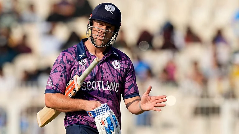 Scotland's George Munsey reacts as he leaves the ground after losing his wicket during the T20 World Cup match between England and Scotland in Kolkata. - AP