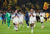 | Photo: AP/Martin Meissner : Atalanta players thank their fans after the Champions League knockout playoff first leg soccer match between Borussia Dortmund and Atalanta in Dortmund, Germany.
