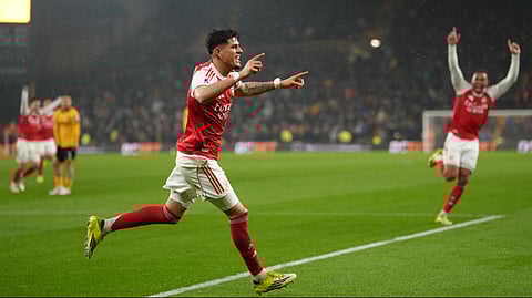 Arsenal's Piero Hincapie, celebrates after scoring his side the second goal during the Premier League soccer match between Wolverhampton Wanderers and Arsenal in Wolverhampton, England, Wednesday, Feb. 18, 2026.