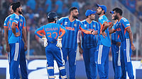 AP : India's Varun Chakravarthy, centre, celebrates with teammates the wicket of Netherlands' Max O'Dowd during their T20 World Cup match in Ahmedabad.
